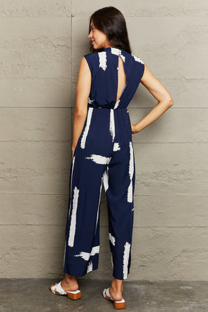 PRINTED ROUND NECK CUTOUT JUMPSUIT WITH POCKETS - Evolve Elegance Boutique