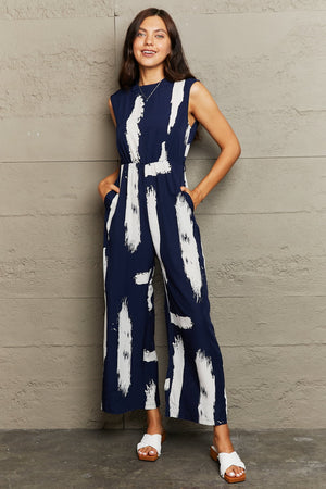 PRINTED ROUND NECK CUTOUT JUMPSUIT WITH POCKETS - Evolve Elegance Boutique